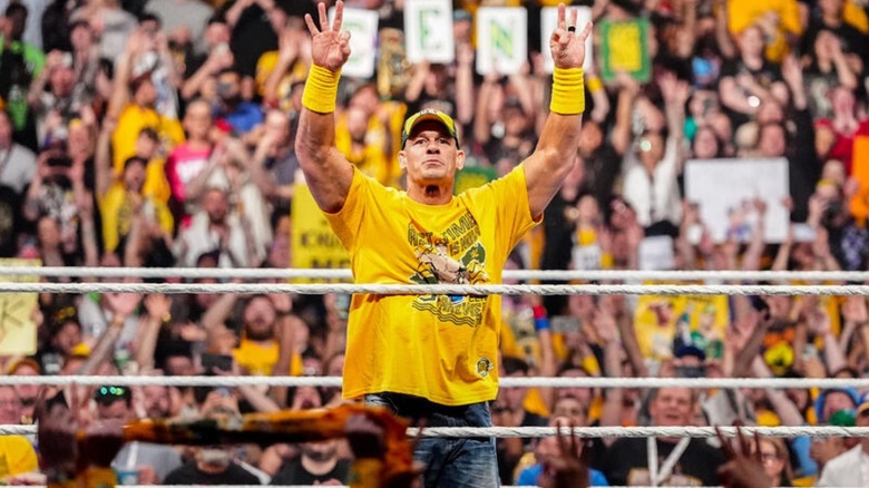 John Cena poses in the ring before his match at Crown Jewel against AJ Styles.