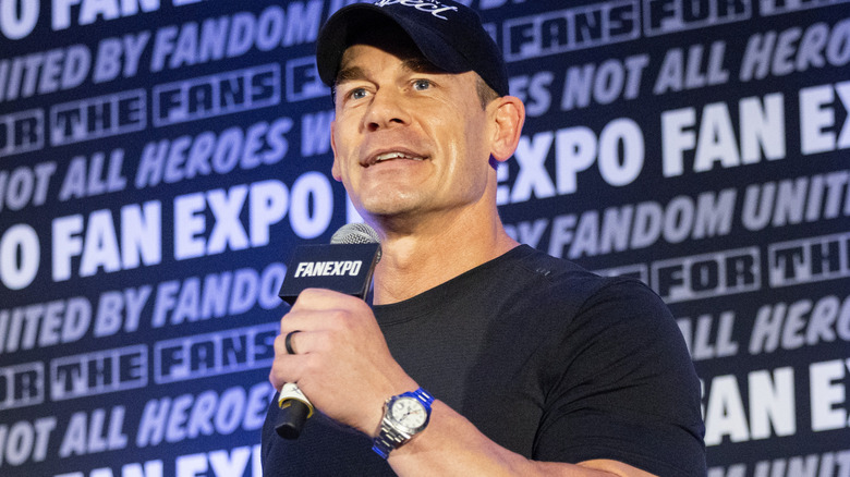 John Cena holding a microphone