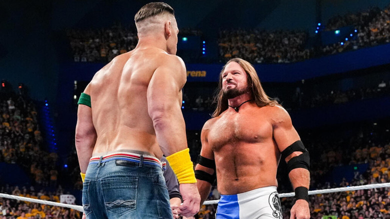 John Cena looking at AJ Styles
