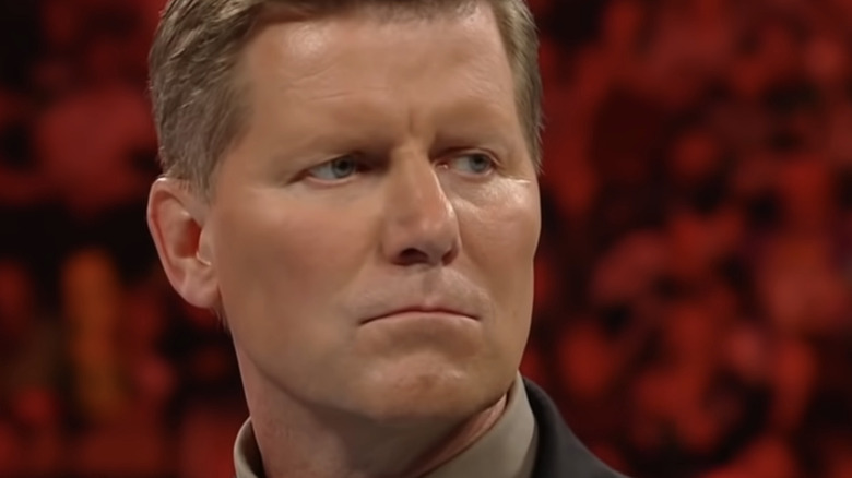 John Laurinaitis scowling