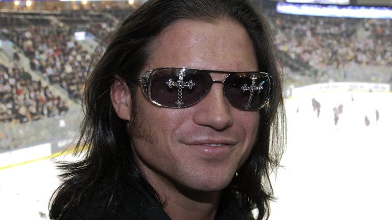 John Hennigan, as John Morrison, attends a hockey game.