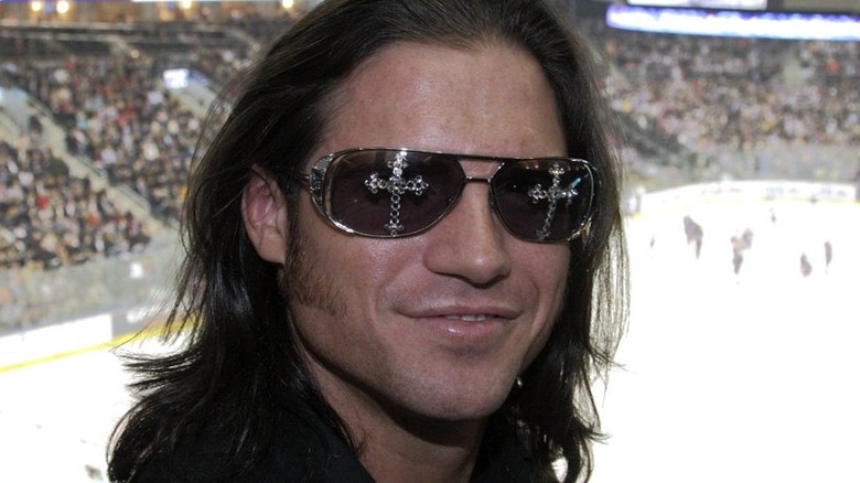 John Hennigan, as John Morrison, attends a hockey game.