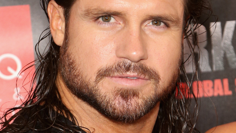 John Morrison looking into camera