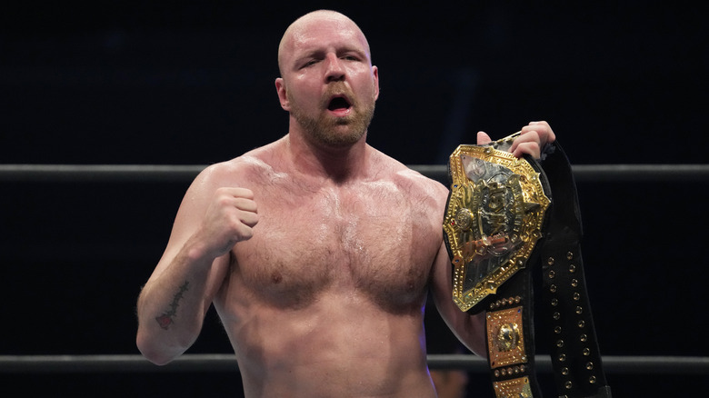 Jon Moxley poses with IWGP World Heavyweight Title
