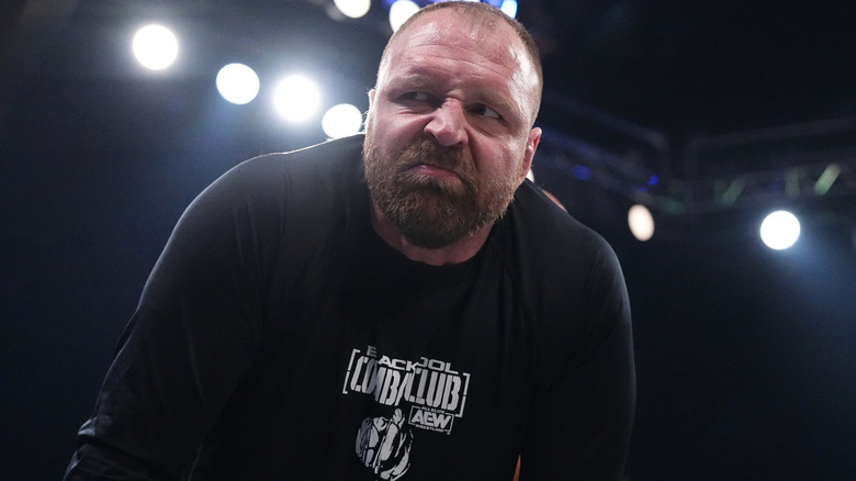 Jon Moxley looking angrily to the side wearing a Blackpool Combat Club shirt