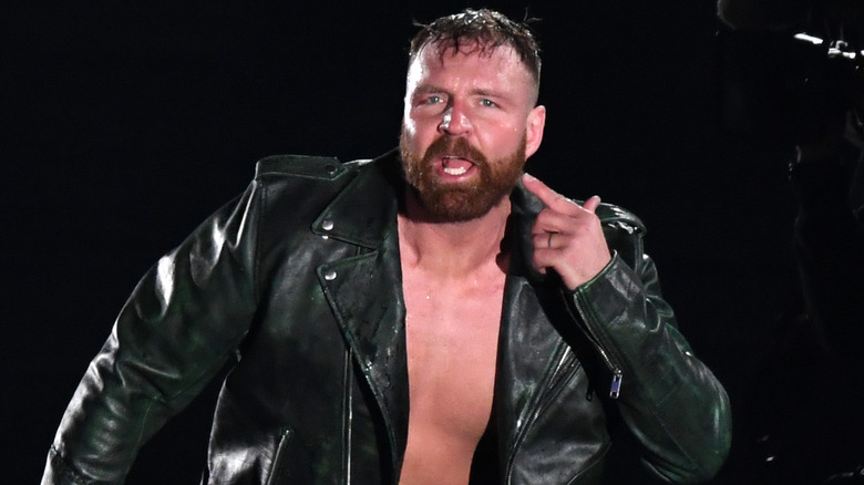 Jon Moxley points to his face