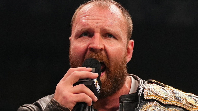 Jon Moxley holding a microphone