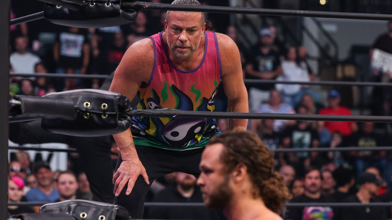 Rob Van Dam in the ring, while Jack Perry stands in foreground