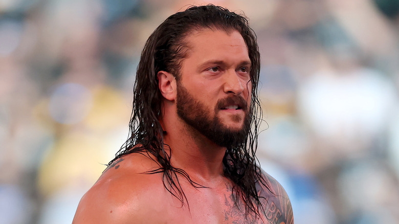 Karrion Kross ponders his existence while looking out at the crowd
