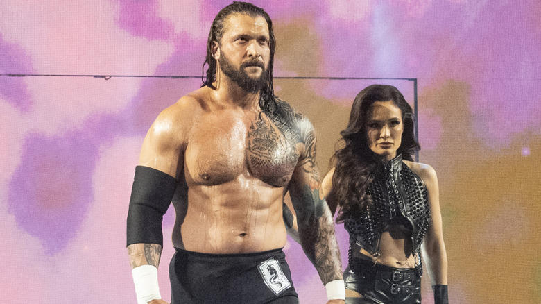 Karrion Kross and Scarlett walking