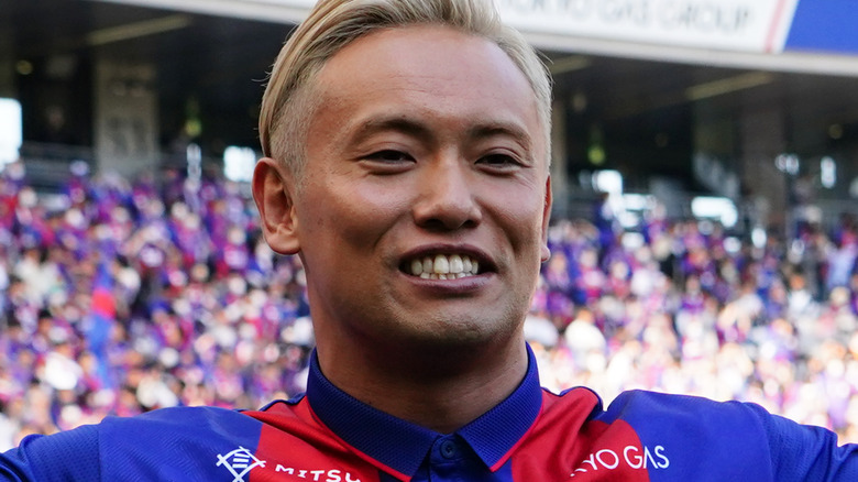 Okada at a football match
