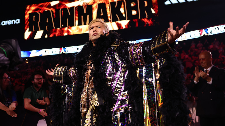 Kazuchika Okada poses on the stage before his AEW World Championship match against Will Ospreay at 