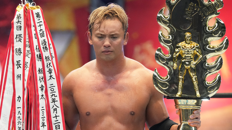 Kazuchika Okada poses with G1 trophy