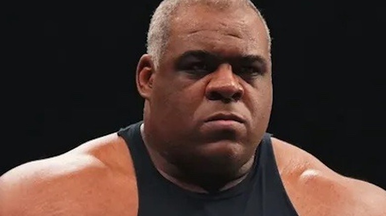 Keith Lee posing in the ring