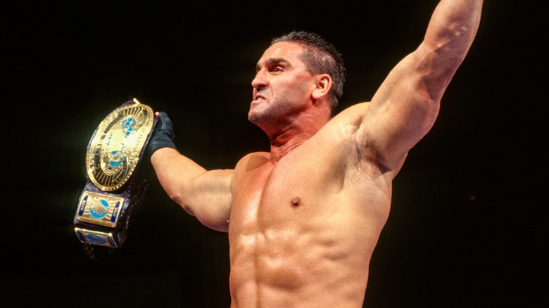 Ken Shamrock celebrating with the WWE Intercontinental Championship.
