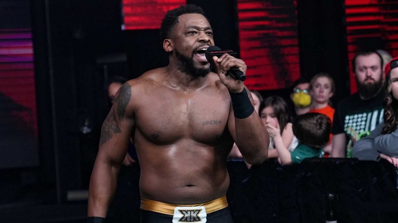 Kenny King talking into microphone
