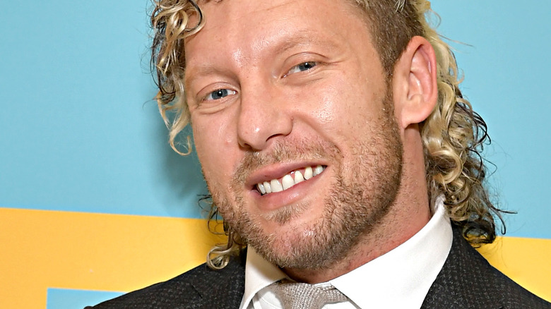 Kenny Omega posing