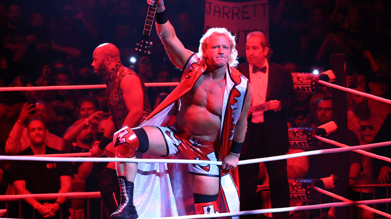 Jeff Jarrett raising his guitar