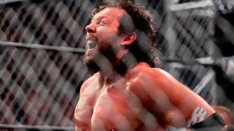 Kenny Omega in a lot of pain in cage match
