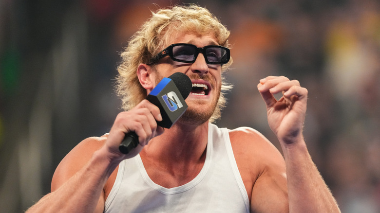 Logan Paul speaking passionately into a WWE SmackDown mic
