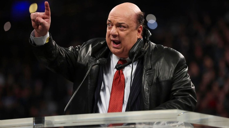 Paul Heyman gives his induction speech during the 2024 Hall of Fame wearing his old ECW gear, complete with headset.