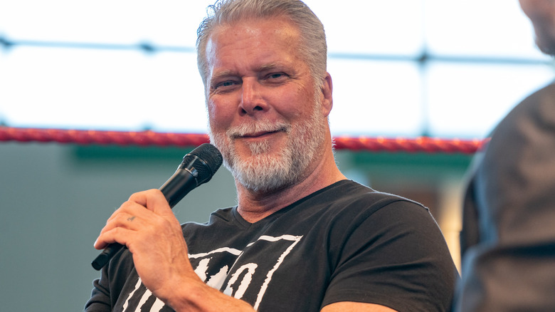Kevin Nash with a microphone