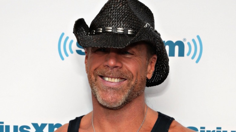 Shawn Michaels smiling with his cowboy hat on