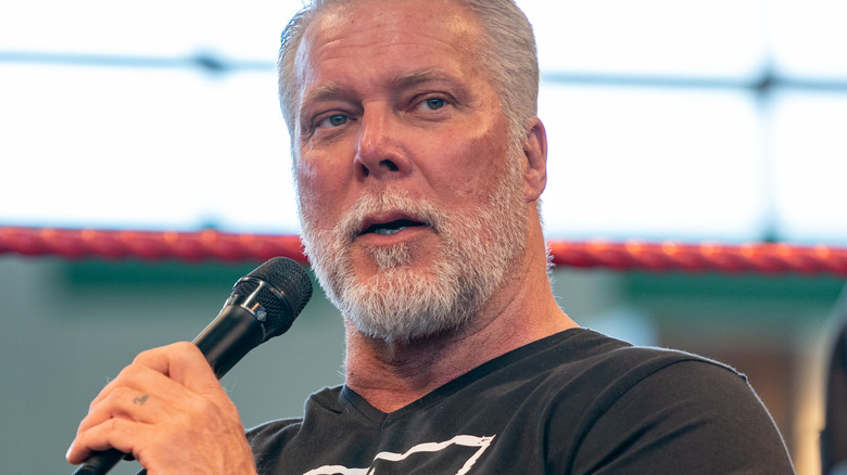 Kevin Nash with a microphone