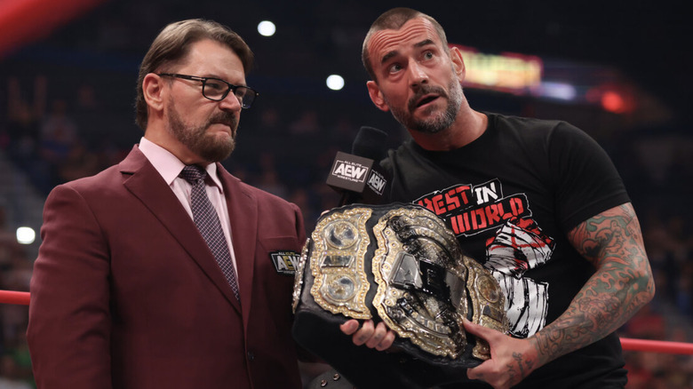 CM Punk holding his championship