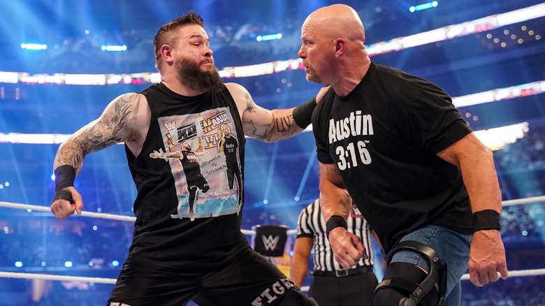 Kevin Owens punching "Stone Cold" Steve Austin