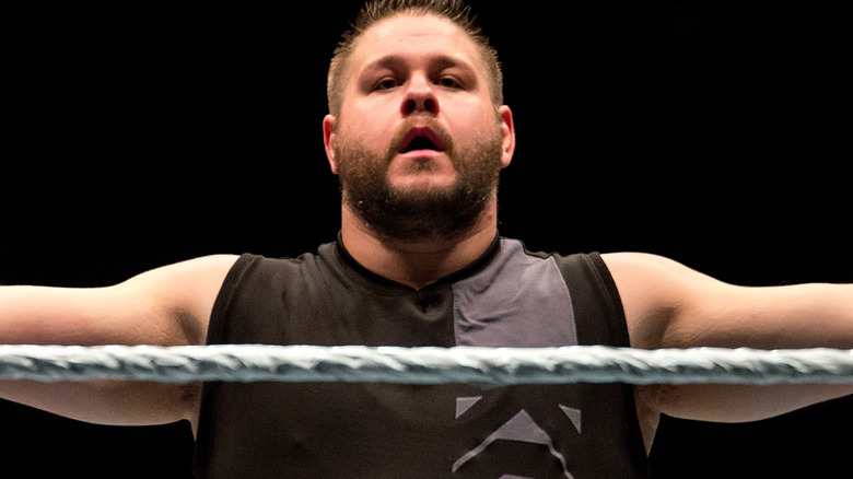 Kevin Owens posing in the ring