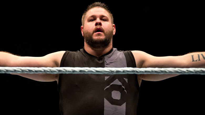 Kevin Owens spreads his arms