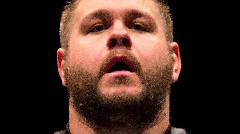 Kevin Owens posing 