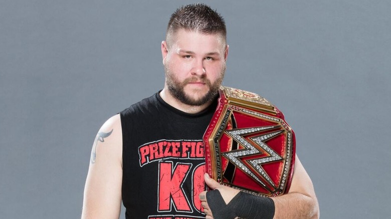 Kevin Owens poses with Universal Championship