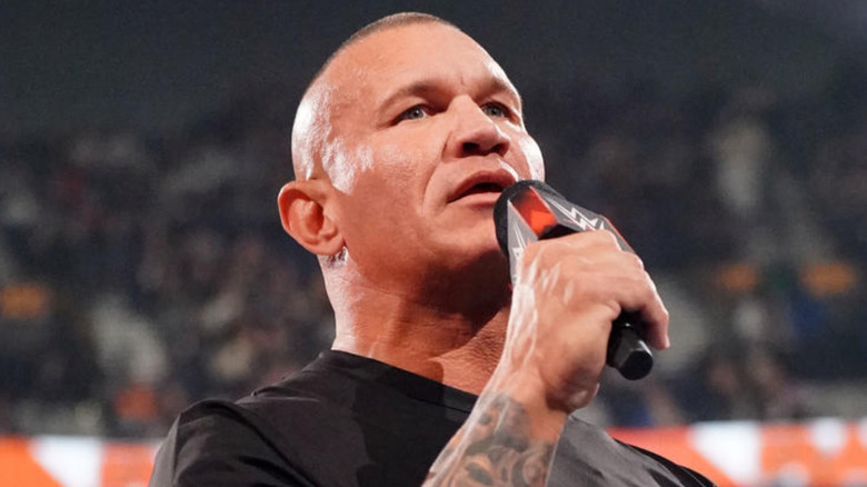 Randy Orton speaking into a microphone