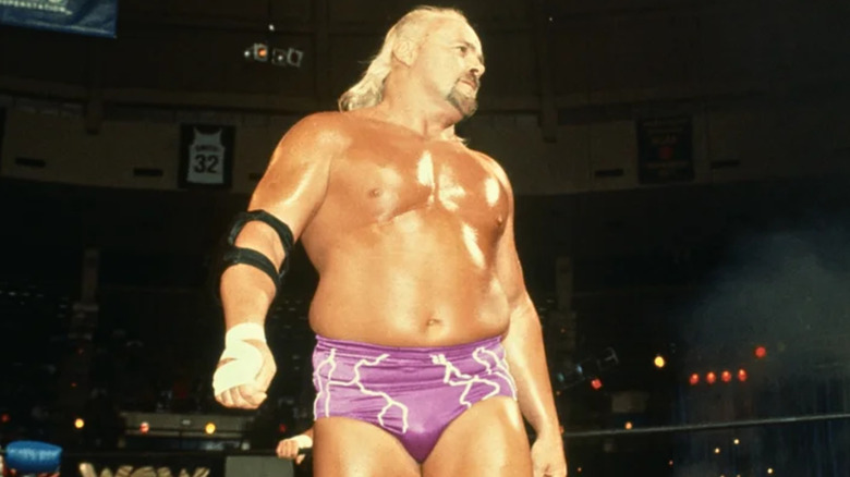 Kevin Sullivan wearing purple wrestling trunk