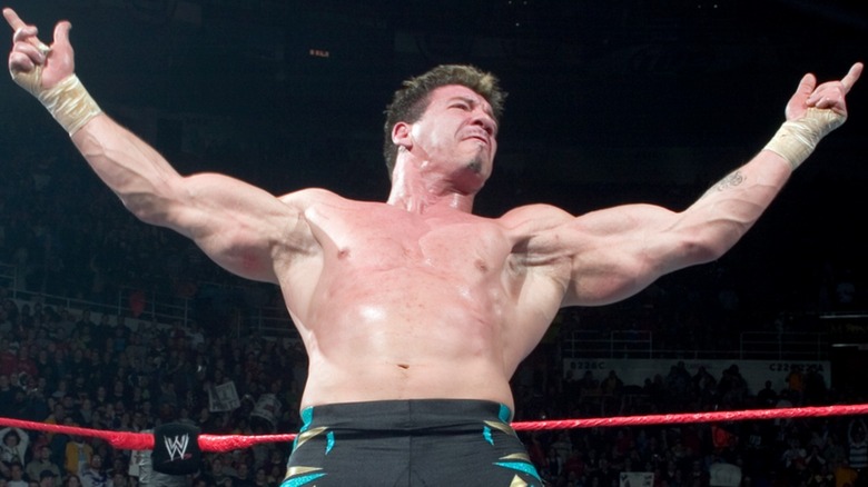 Eddie Guerrero poses in the middle of the ring during a match on WWE television.