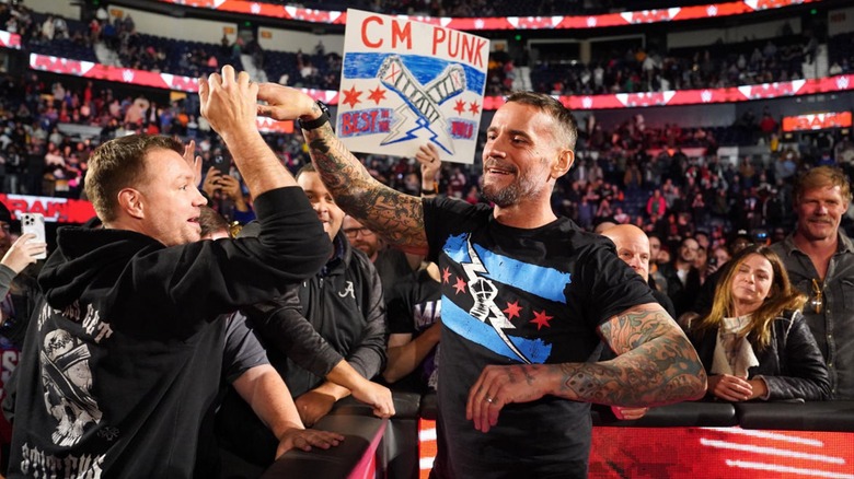 CM Punk greets a fan at WWE Raw