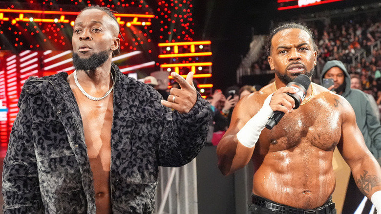 Kofi Kingston and Xavier Woods standing beside one another
