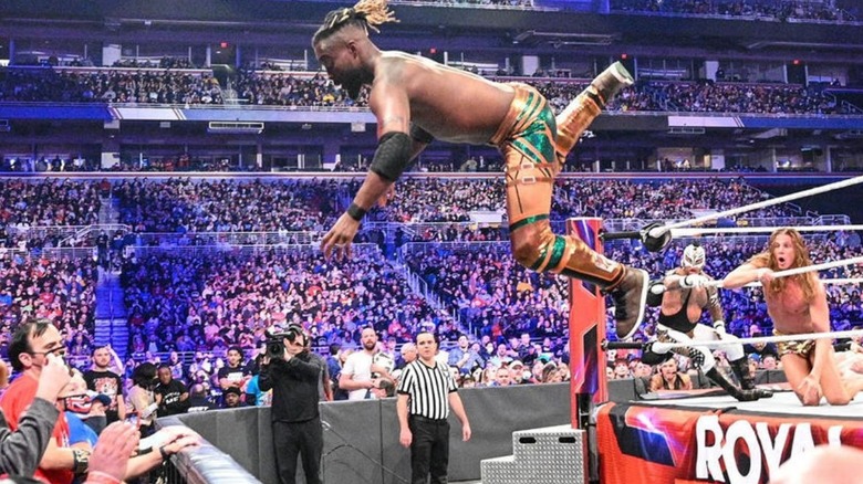 Kofi Kingston flies from the ring during the Royal Rumble to the barricade, trying to avoid elimination.
