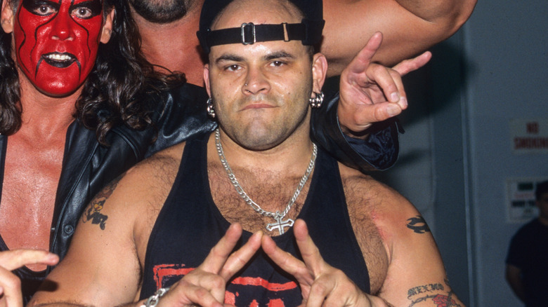Konnan poses