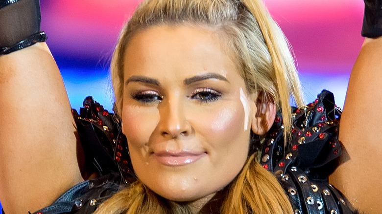 Natalya holds title belt high