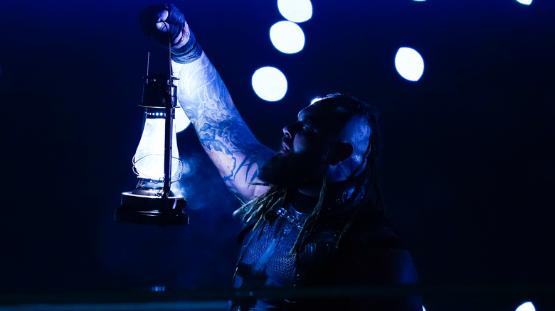 Bray Wyatt holds lamp