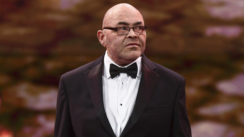 Konnan wearing a tuxedo