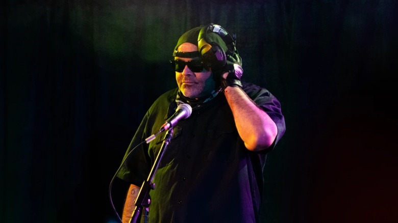 Konnan wearing headphones