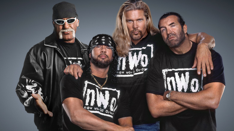 Hulk Hogan, X-Pac, Kevin Nash, and Scott Hall are posing