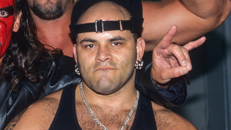 Konnan poses with the NWO Wolfpac