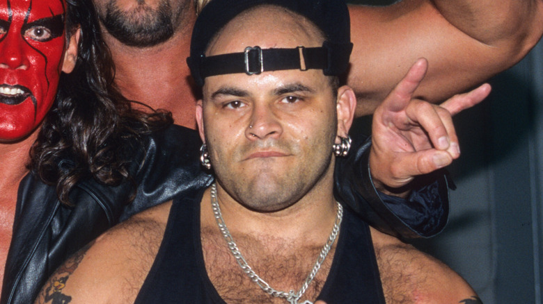 Konnan, alongside Sting, Lex Luger, and Kevin Nash for a backstage photo op as nWo Wolfpac.