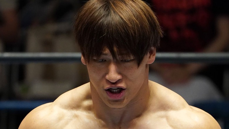 Kota Ibushi looks on mid-sentence.