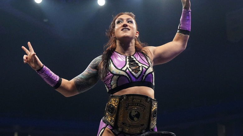 Kris Statlander ahead of a match posing on the turnbuckle during an episode of 